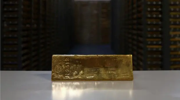 Gold Hits 2-Week High as Dollar Eases Ahead of Fed Meet